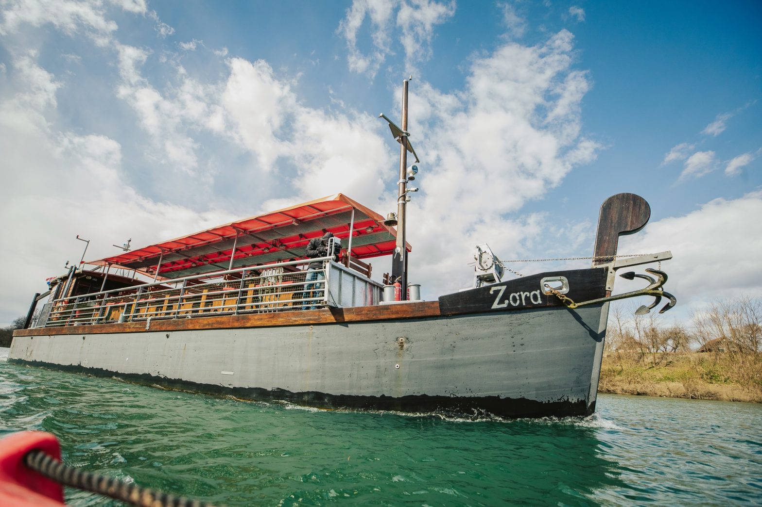 The boat Zora on the river Kupa in a sunny day